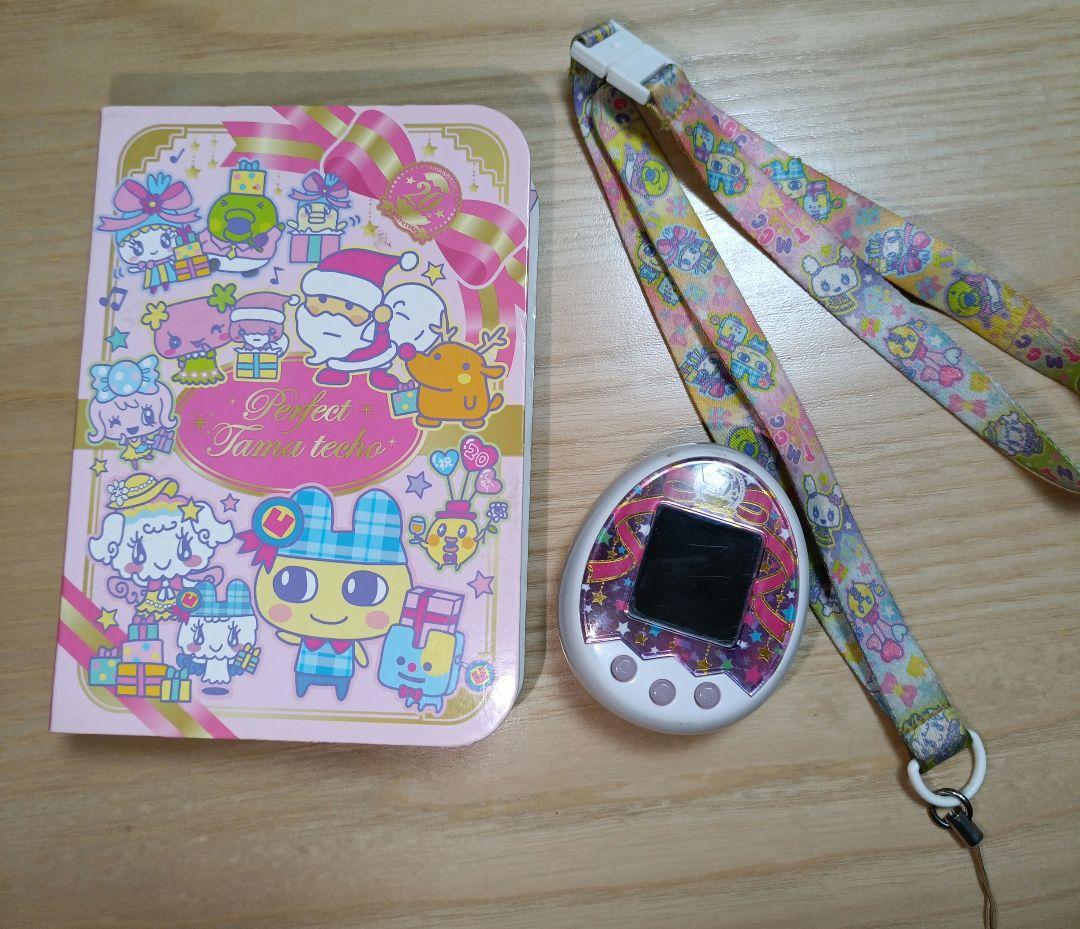 Tamagotchi たまごっちミックス20周年 ガイドブック・ストラップ付き Tamagotchi たまごっちミックス20周年 ガイドブック・ストラップ付き